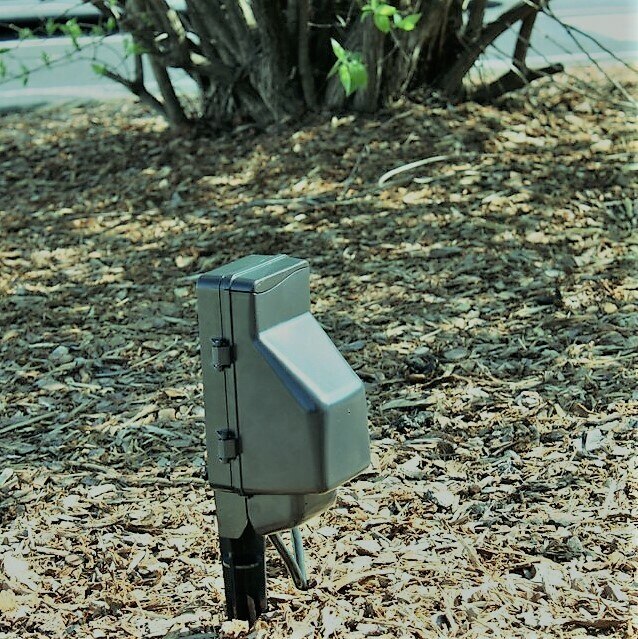 SGPWS Power Outlet Outdoor Hidden Camera w/ WiFi In a Flowerbed