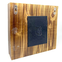 Back Side where SD Card Goes Discreet wood frame décor with built-in motion-activated camera