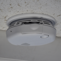 ceiling-mount smoke detector camera — scale comparison