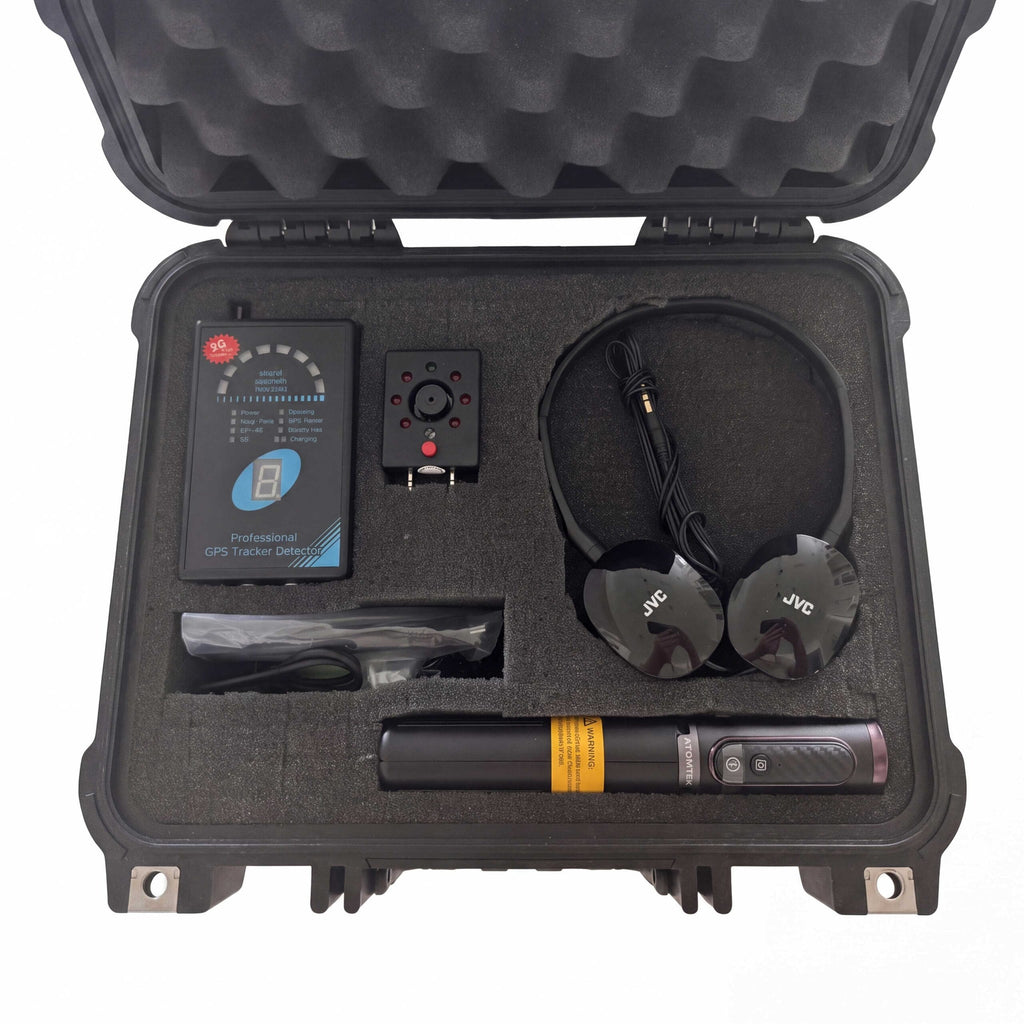 Vehicle GPS detector kit in an open case with detector, magnet probe, JVC headphones, cables, and an extendable pole